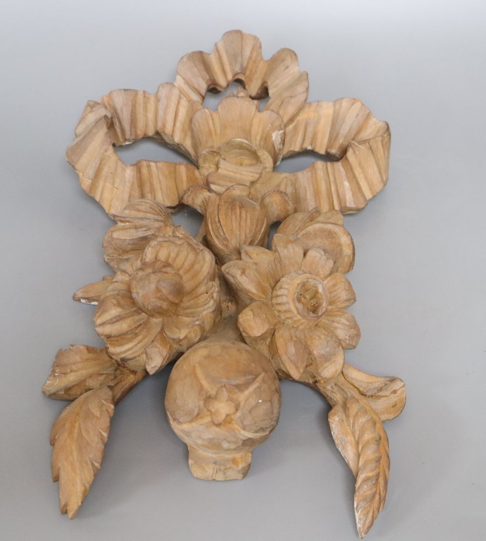A carved beech ribbon and fruit wall applique, length 47cm